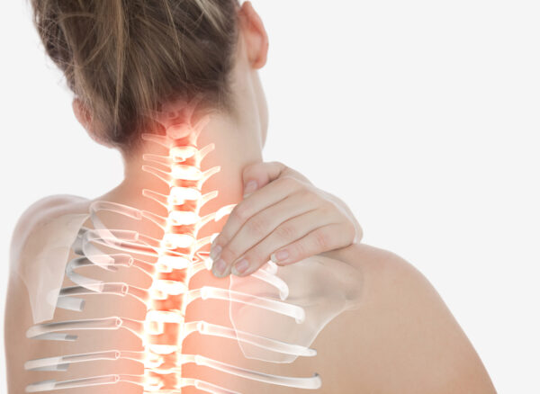 Digital composite of Highlighted spine of woman with neck pain